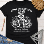 Black cotton women's funny woodworking graphic tee with a dog supervisor design. Women's funny woodworking graphic tee shirt for female woodworkers, makers, and DIY builders — Sawdust & Ponytails