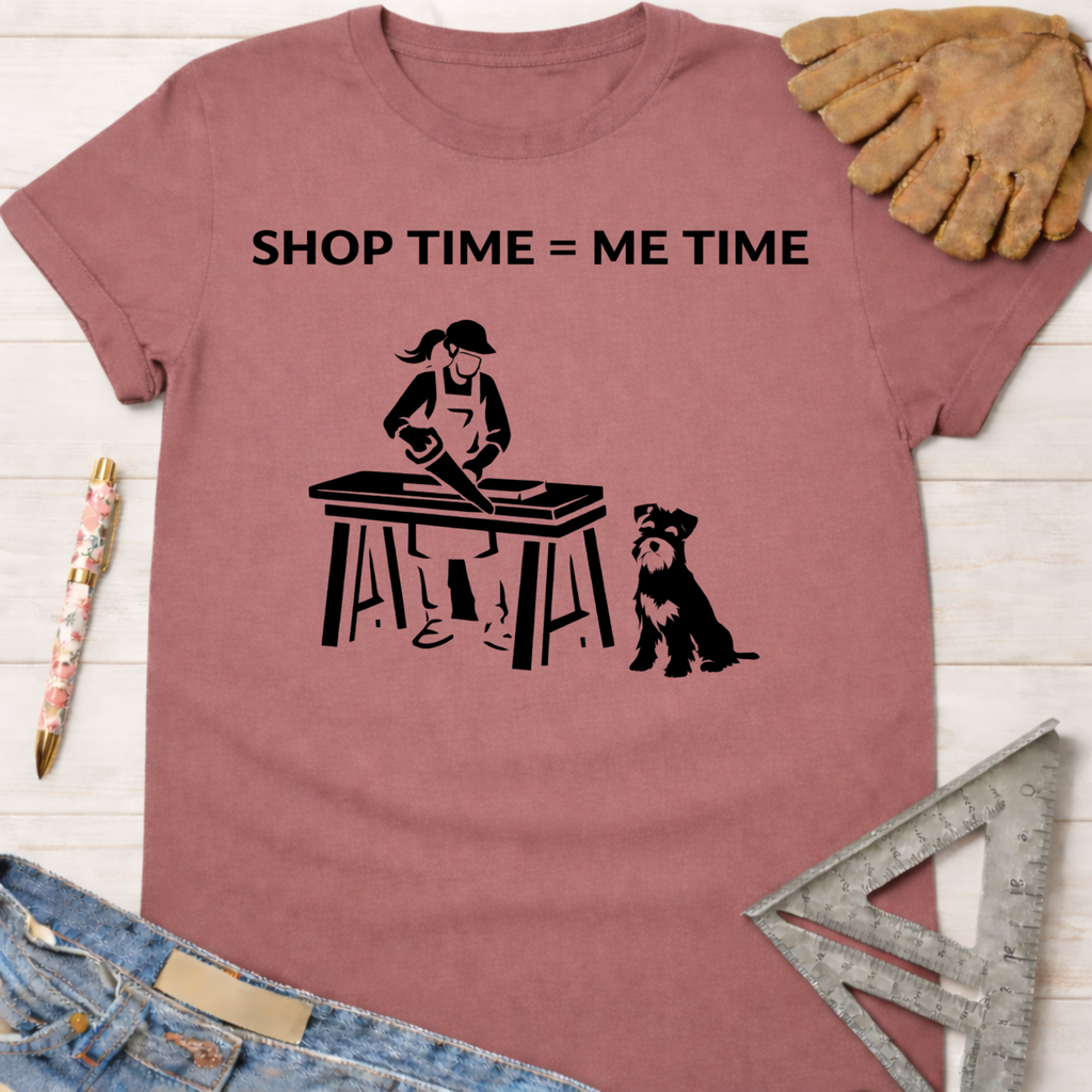 Women's funny woodworking graphic tee shirt for female woodworkers, makers, and DIY builders — Sawdust & Ponytails. Mauve t-shirt with "SHOP TIME = ME TIME" text, a woman sawing wood, and a dog.