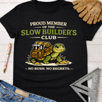 Black women's funny woodworking graphic tee with a turtle carrying tools and "Slow Builder's Club" text. Sawdust & Ponytails.