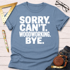 Women's funny woodworking graphic tee shirt for female woodworkers, makers, and DIY builders — Sawdust & Ponytails. Blue cotton tee with "Sorry. Can't. Woodworking. Bye." in white text.