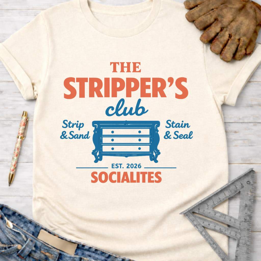 Women's funny woodworking graphic tee shirt for female woodworkers, makers, and DIY builders — Sawdust & Ponytails. Cream t-shirt with "The Stripper's Club Socialites" text and a dresser graphic.