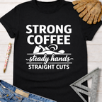 Women's funny woodworking graphic tee shirt for female woodworkers, makers, and DIY builders — Sawdust & Ponytails. Black cotton tee with "Strong Coffee, Steady Hands, Straight Cuts" graphic.