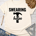 Women's funny woodworking graphic tee shirt for female woodworkers, makers, and DIY builders — Sawdust & Ponytails. Cream t-shirt with "SWEARING helps" and hammer graphic.