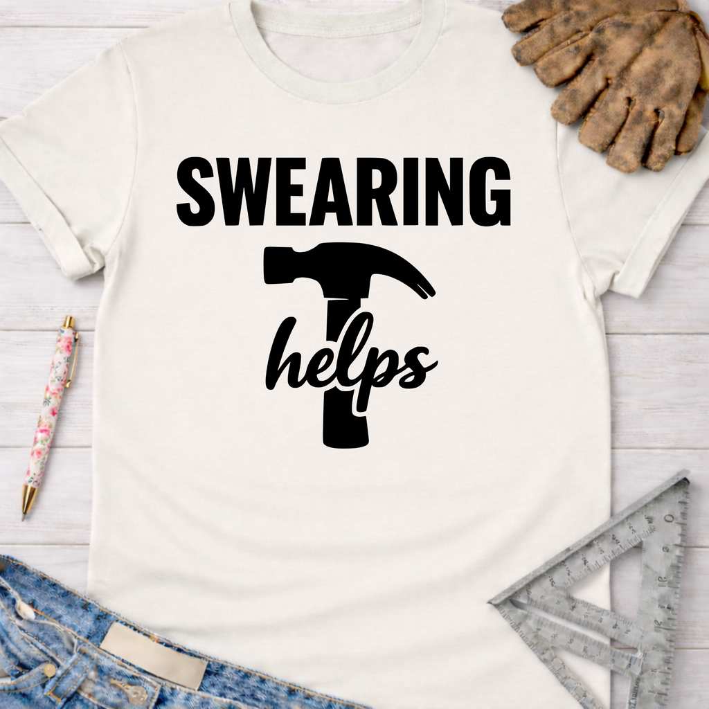 Women's funny woodworking graphic tee shirt for female woodworkers, makers, and DIY builders — Sawdust & Ponytails. White cotton tee with "SWEARING helps" text and hammer graphic.