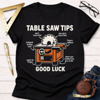 Black women's funny woodworking graphic tee with "Table Saw Tips Good Luck" design. Sawdust & Ponytails.