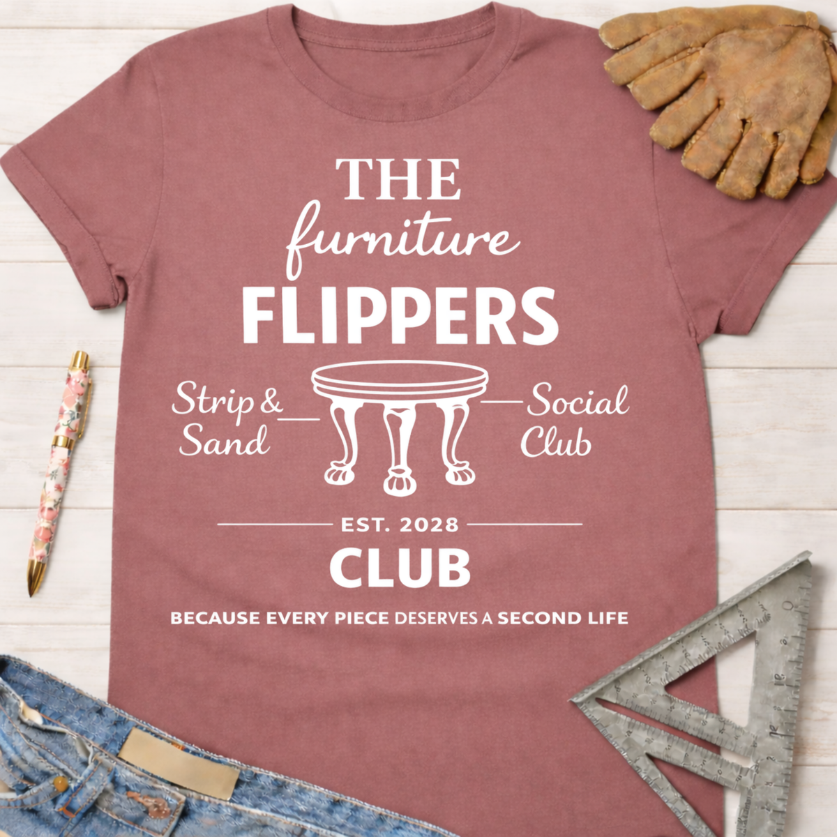 Women's funny woodworking graphic tee shirt for female woodworkers, makers, and DIY builders — Sawdust & Ponytails. Dusty rose t-shirt with "The Furniture Flippers Social Club" graphic.