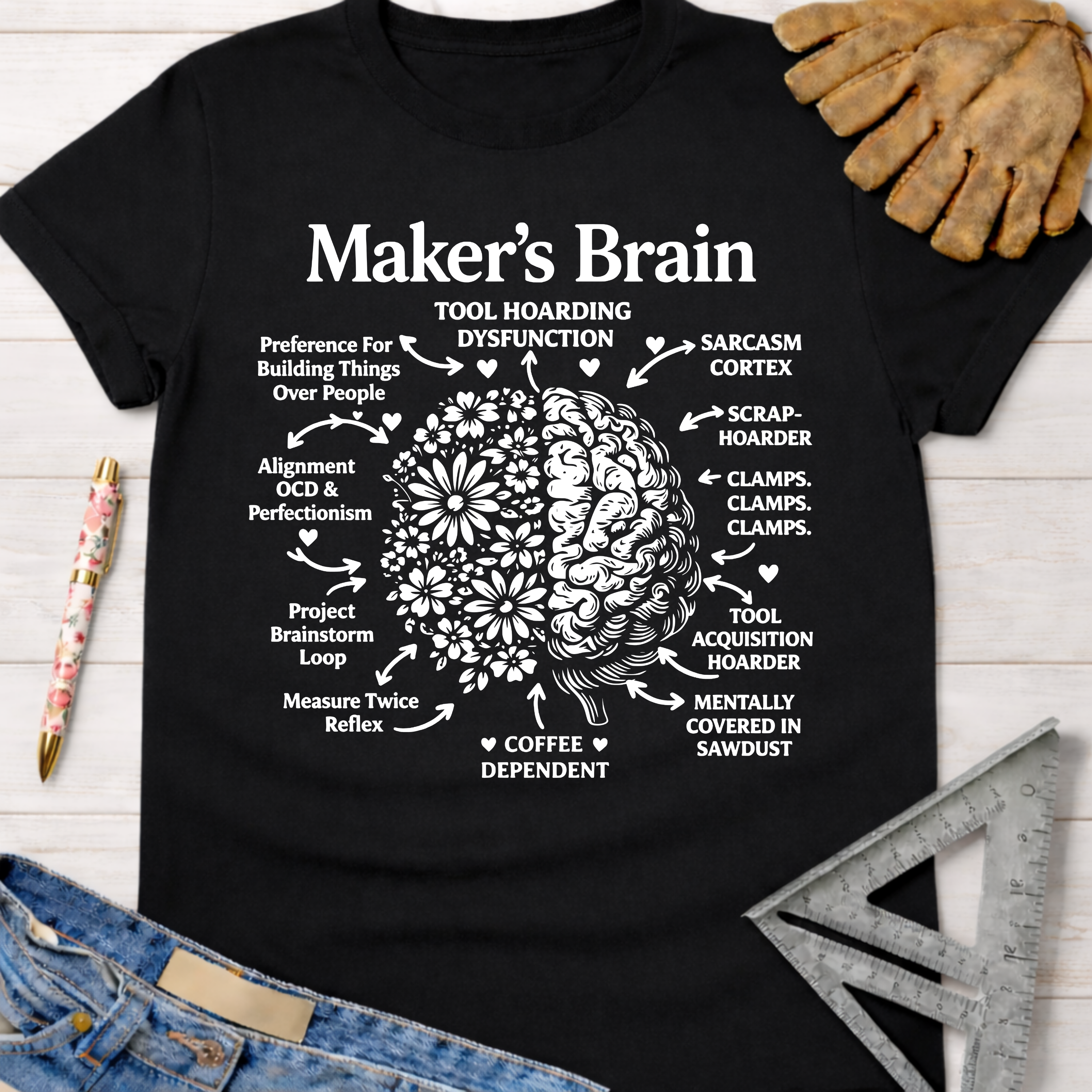Black cotton "Maker's Brain" graphic tee with a floral and gear brain design, perfect for female woodworkers.