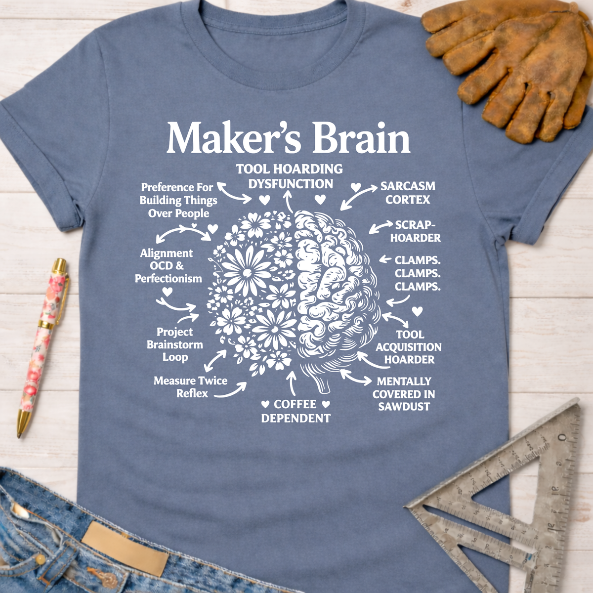 Women's funny woodworking graphic tee shirt for female woodworkers, makers, and DIY builders — Sawdust & Ponytails. Blue cotton tee with white "Maker's Brain" graphic.
