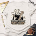 White cotton t-shirt with a cartoon Einstein holding a ruler and wood, text reads "The Numbers Checked Out The Board Didn't".
