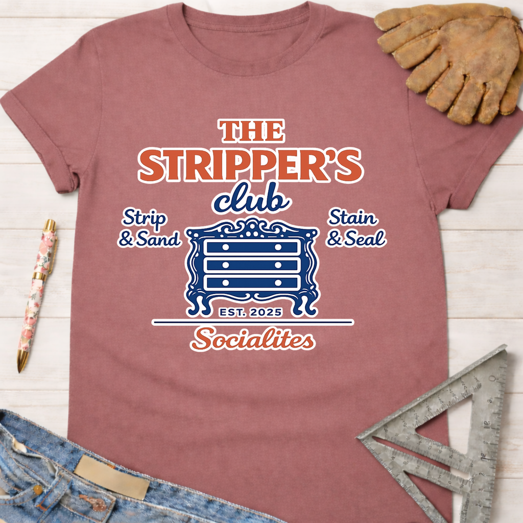 Women's funny woodworking graphic tee shirt for female woodworkers, makers, and DIY builders — Sawdust & Ponytails. Mauve cotton tee with "The Stripper's Club Socialites" graphic featuring a dresser.