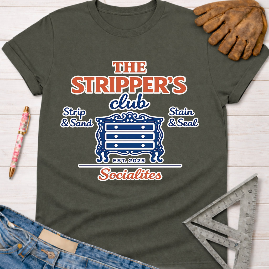 Women's funny woodworking graphic tee shirt for female woodworkers, makers, and DIY builders — Sawdust & Ponytails. Dark gray t-shirt with "The Stripper's Club Socialites" graphic featuring a dresser, "Strip & Sand," and "Stain & Seal.