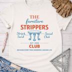Women's funny woodworking graphic tee shirt for female woodworkers, makers, and DIY builders — Sawdust & Ponytails. Cream cotton tee with "The Furniture Strippers Social Club" graphic in red and blue, featuring a table icon.