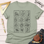 Sage green cotton t-shirt with black tool stamp graphics, featuring woodworking tools and floral accents.