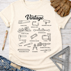 Women's funny woodworking graphic tee shirt for female woodworkers, makers, and DIY builders — Sawdust & Ponytails. Cream t-shirt with black line art of vintage tools.