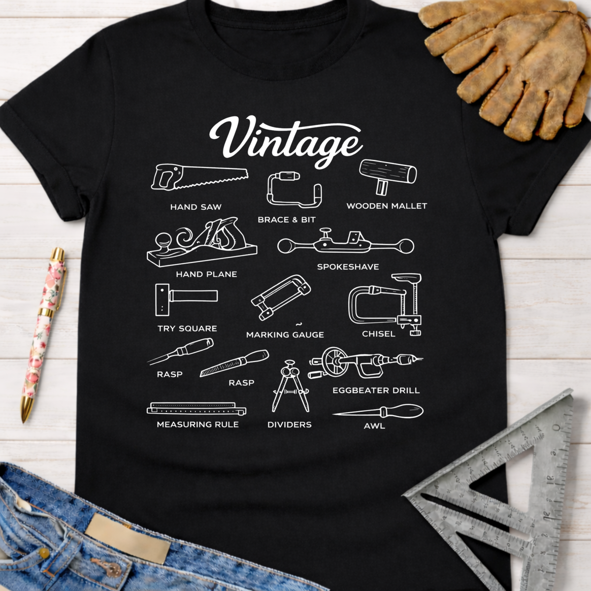 Women's funny woodworking graphic tee shirt for female woodworkers, makers, and DIY builders — Sawdust & Ponytails. Black cotton t-shirt with white line art illustrations of vintage woodworking tools.