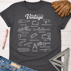 Women's funny woodworking graphic tee shirt for female woodworkers, makers, and DIY builders — Sawdust & Ponytails. Dark gray cotton tee with white vintage hand tool illustrations.