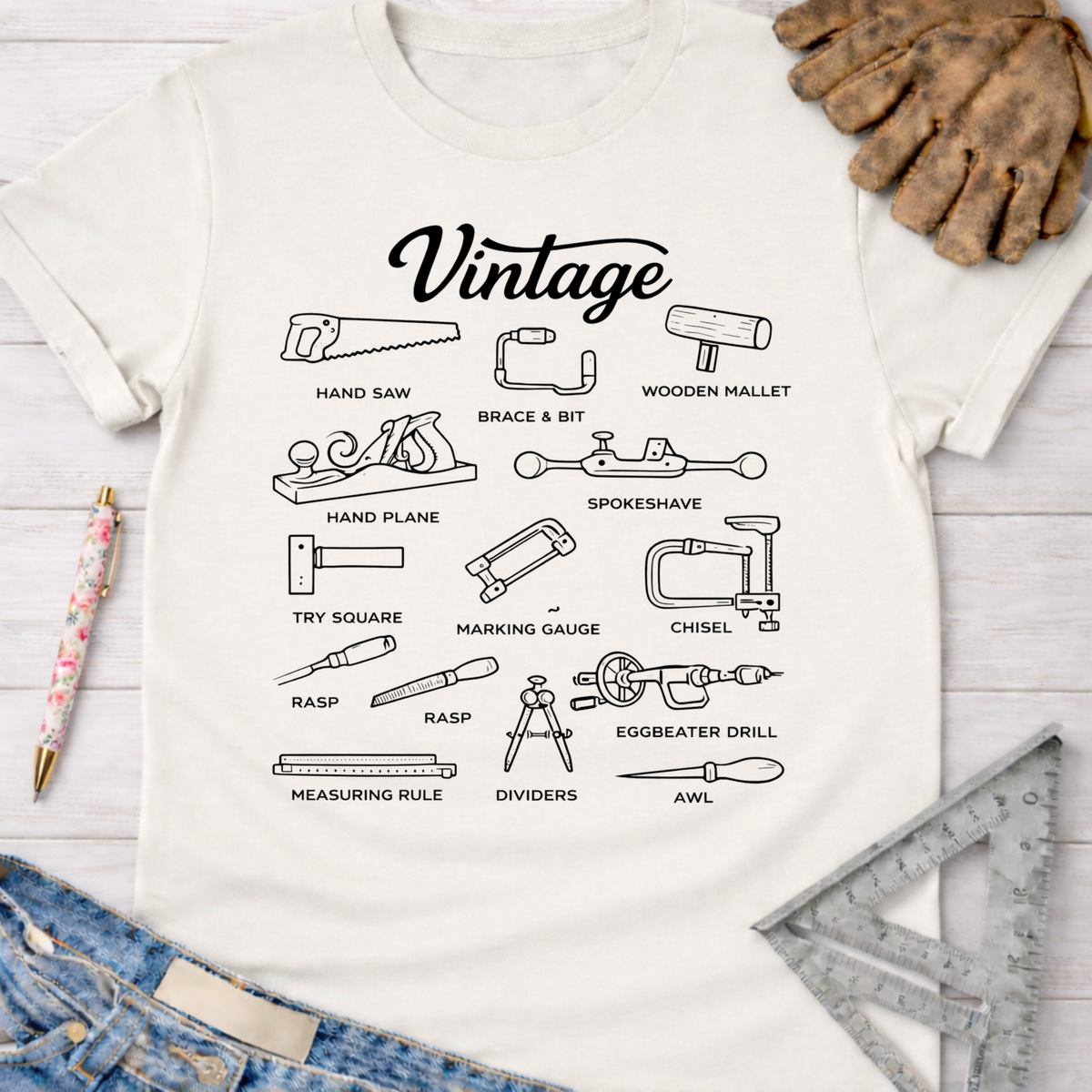 Women's funny woodworking graphic tee shirt for female woodworkers, makers, and DIY builders — Sawdust & Ponytails. White cotton tee with black line art of vintage hand tools.