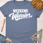Women's funny woodworking graphic tee shirt for female woodworkers, makers, and DIY builders — Sawdust & Ponytails. Blue cotton t-shirt with "Weekend Warrior" in white text, next to work gloves, jeans, and a ruler.