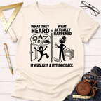 Women's funny woodworking graphic tee shirt for female woodworkers, makers, and DIY builders — Sawdust & Ponytails. Cream short-sleeve t-shirt with "What They Heard vs What Actually Happened" graphic.