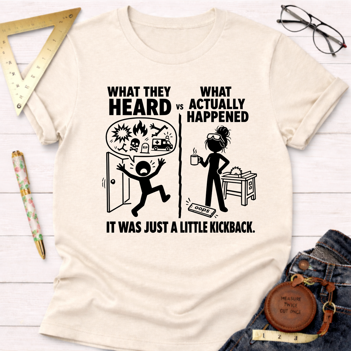 Women's funny woodworking graphic tee shirt for female woodworkers, makers, and DIY builders — Sawdust & Ponytails. Cream short-sleeve t-shirt with "What They Heard vs What Actually Happened" graphic.