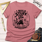 Pink cotton t-shirt with a cute raccoon builder graphic, "I Build Stuff. What's Your Superpower?" text.