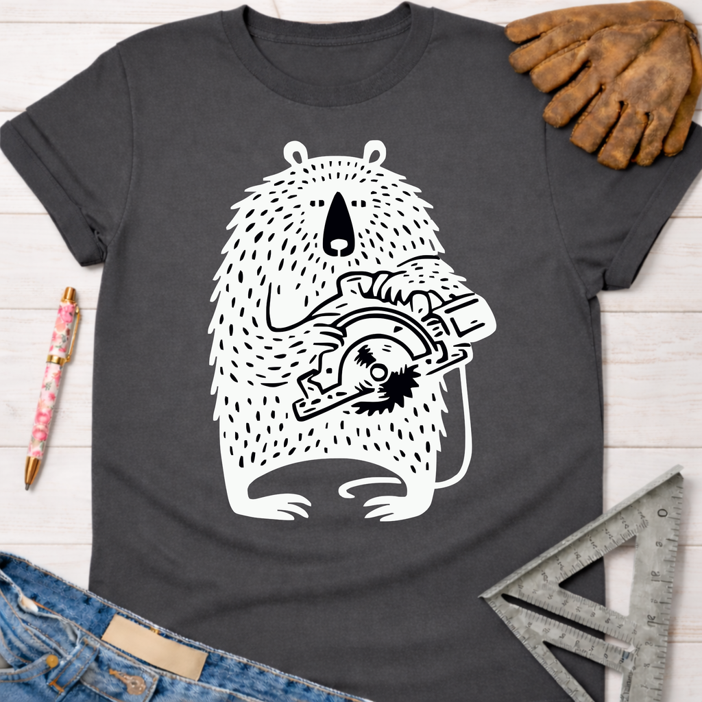 Women's funny woodworking graphic tee shirt for female woodworkers, makers, and DIY builders — Sawdust & Ponytails. Dark gray tee with a white bear holding a circular saw.