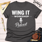 Charcoal gray cotton t-shirt with "WING IT WORKSHOP Podcast" in white text and a microphone icon.