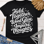 Black women's funny woodworking graphic tee with "Held Together by Wood Glue and Impure Thoughts" in white script.