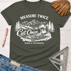 Women's funny woodworking graphic tee shirt for female woodworkers, makers, and DIY builders — Sawdust & Ponytails. Dark gray cotton tee with "Measure Twice Cut Once" graphic.