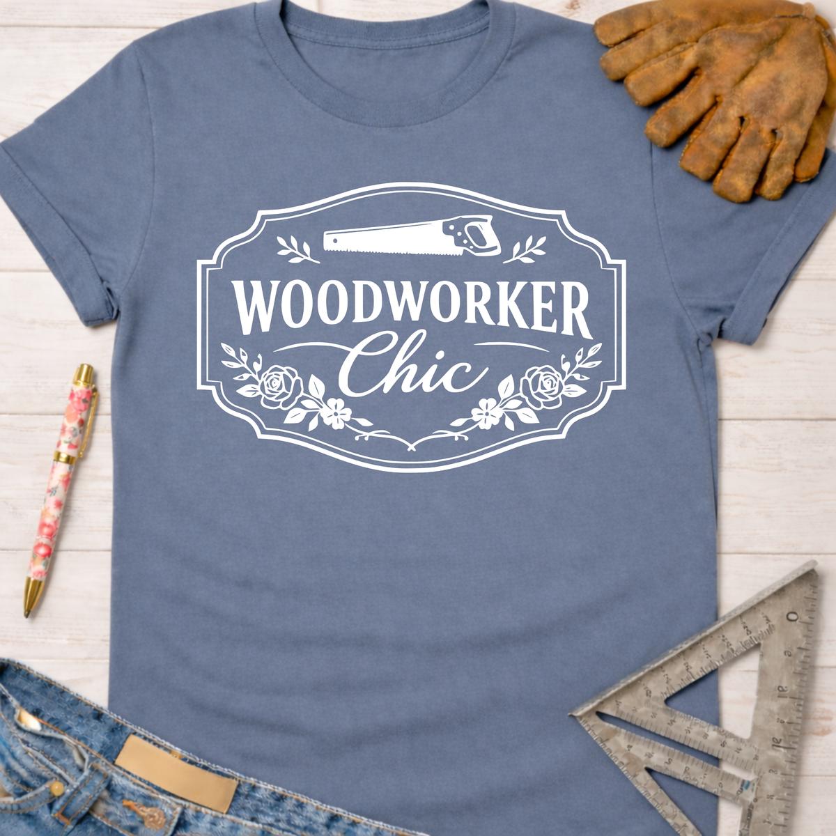 Women's funny woodworking graphic tee shirt for female woodworkers, makers, and DIY builders — Sawdust & Ponytails. Blue cotton tee with "Woodworker Chic" graphic.