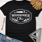 Black cotton "Woodworker Chic" graphic tee with saw and floral design. Women's funny woodworking graphic tee shirt for female woodworkers, makers, and DIY builders — Sawdust & Ponytails