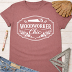 Women's funny woodworking graphic tee shirt for female woodworkers, makers, and DIY builders — Sawdust & Ponytails. Mauve cotton tee with "Woodworker Chic" graphic.