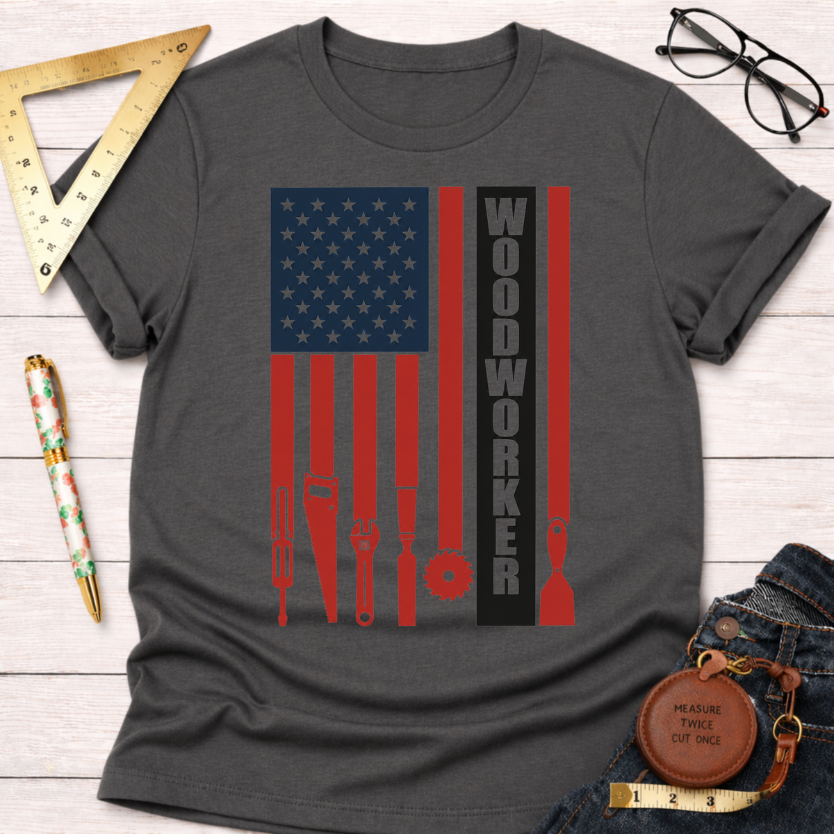 Charcoal gray Woodworker Flag T-shirt with red and blue American flag design featuring woodworking tools.