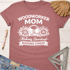 Women's funny woodworking graphic tee shirt for female woodworkers, makers, and DIY builders — Sawdust & Ponytails. Mauve cotton tee with "Woodworker Mom Making Sawdust Raising Chaos" graphic.