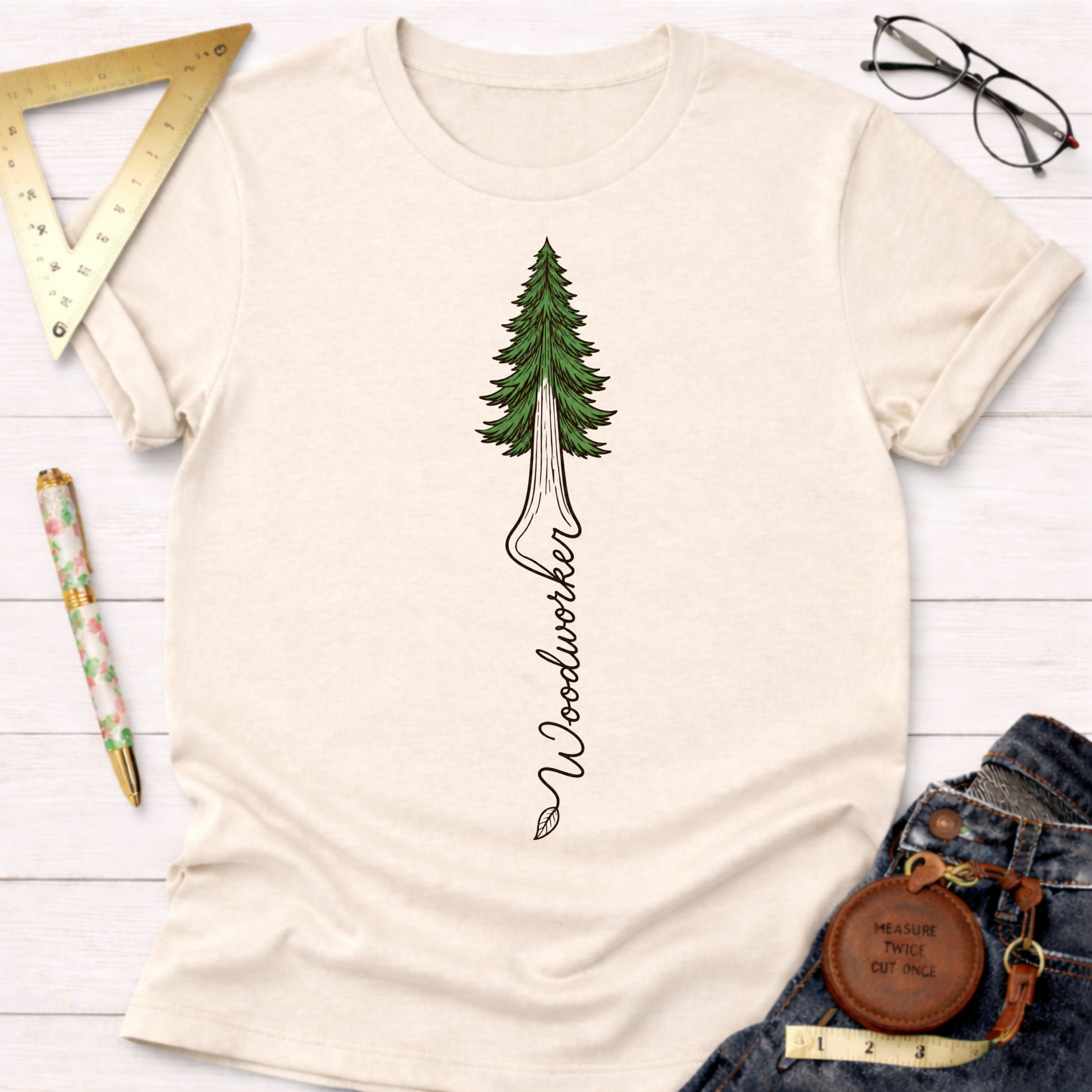 Cream women's funny woodworking graphic tee with a redwood tree and "Woodworker" text. Sawdust & Ponytails.