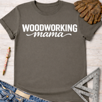 Women's funny woodworking graphic tee shirt for female woodworkers, makers, and DIY builders — Sawdust & Ponytails. Dark gray "Woodworking Mama" t-shirt with white text, jeans, work glove, and ruler.