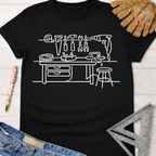 Women's funny woodworking graphic tee shirt for female woodworkers, makers, and DIY builders — Sawdust & Ponytails. Black cotton tee with white line art workshop tools.