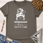 Women's funny woodworking graphic tee shirt for female woodworkers, makers, and DIY builders — Sawdust & Ponytails. Charcoal gray cotton tee with "Workshop Hair Don't Care" graphic.