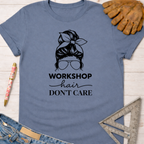 Women's funny woodworking graphic tee shirt for female woodworkers, makers, and DIY builders — Sawdust & Ponytails. Blue short-sleeve t-shirt with "Workshop Hair Don't Care" graphic.