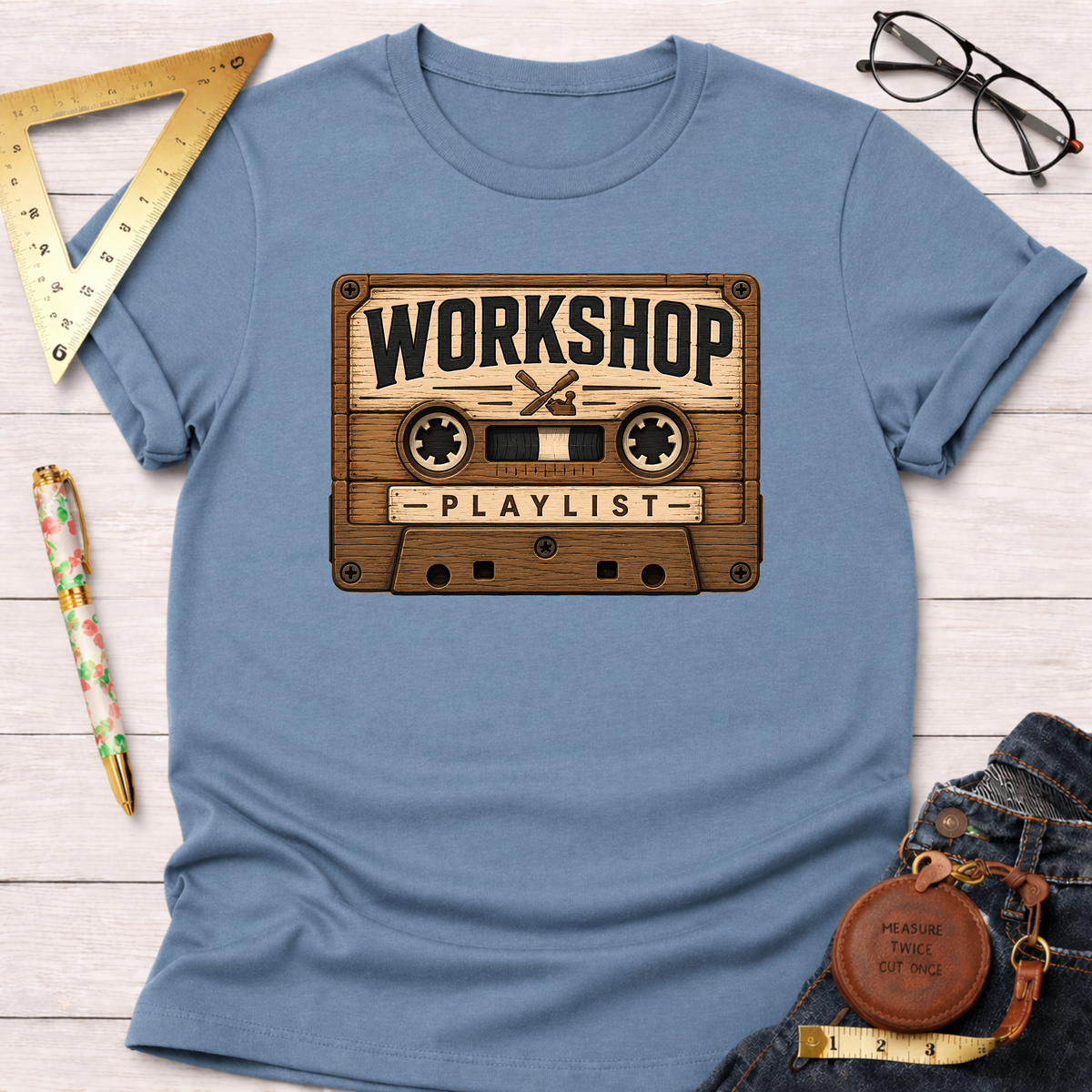 Light blue cotton t-shirt with a vintage wooden cassette tape graphic featuring "Workshop Playlist".