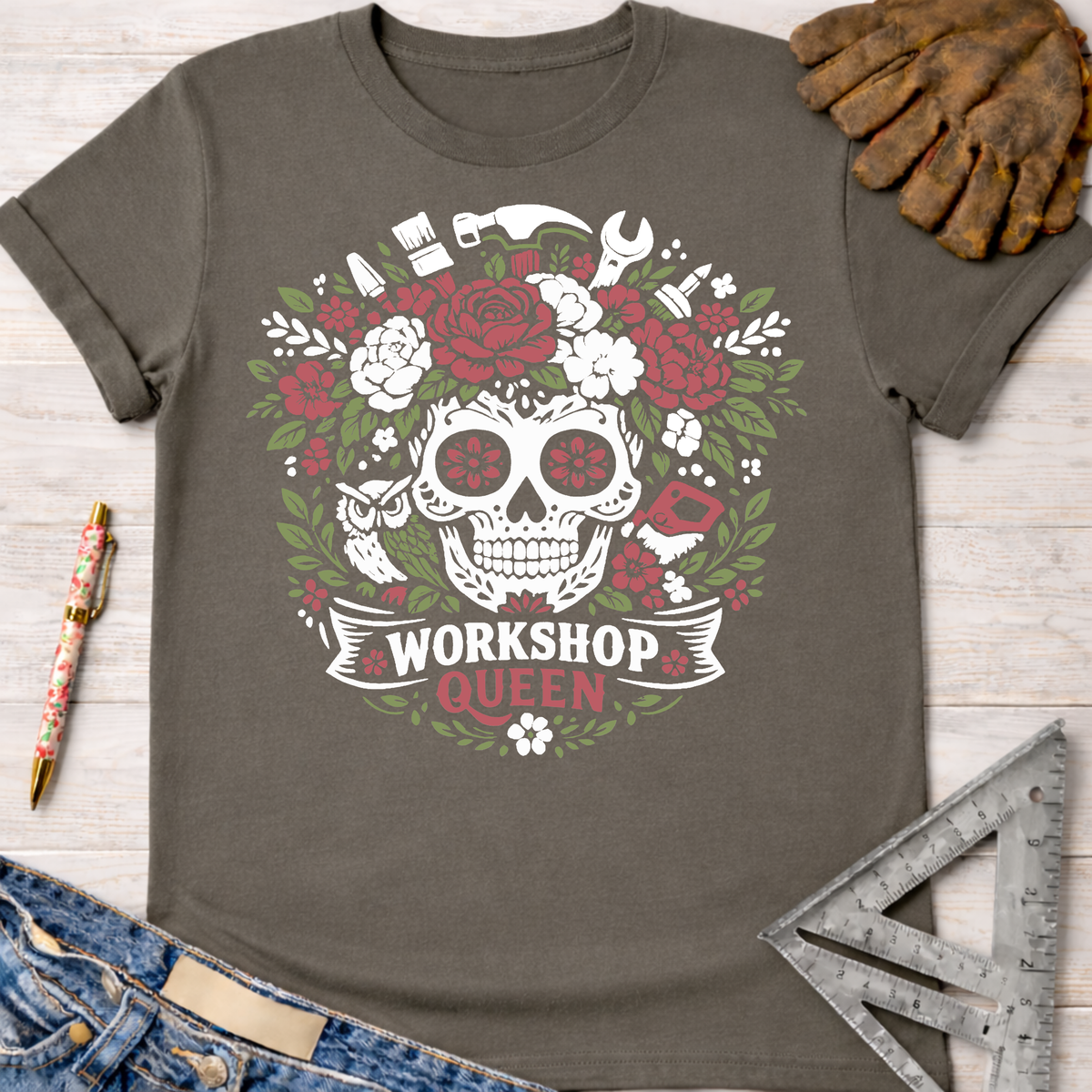 Charcoal gray t-shirt with a floral skull and tools graphic, "Workshop Queen" text. Women's funny woodworking graphic tee shirt for female woodworkers, makers, and DIY builders — Sawdust & Ponytails