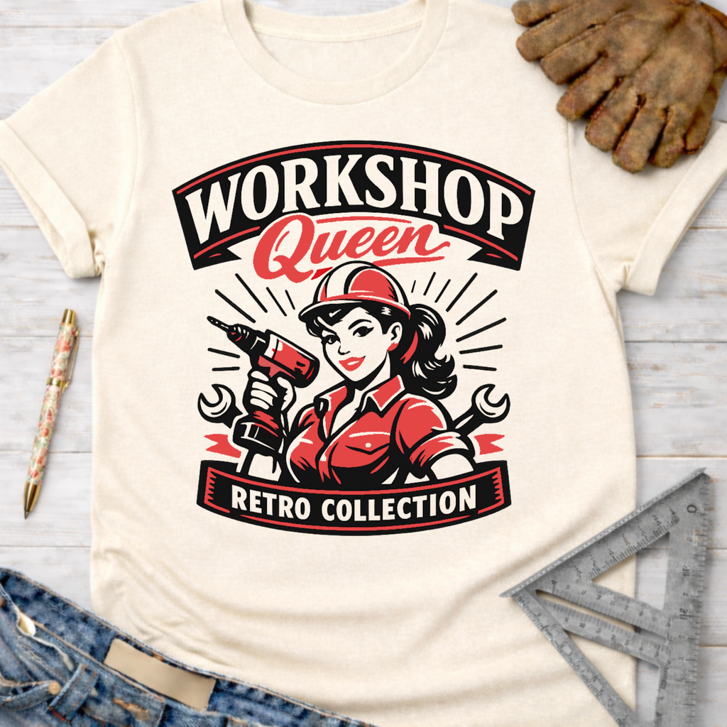 Women's funny woodworking graphic tee shirt for female woodworkers, makers, and DIY builders — Sawdust & Ponytails. Cream retro "Workshop Queen" graphic tee with a woman holding a drill.