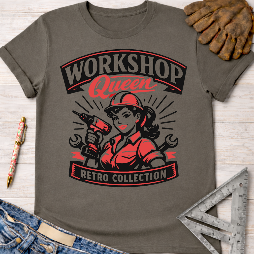 Women's funny woodworking graphic tee shirt for female woodworkers, makers, and DIY builders — Sawdust & Ponytails. Dark gray cotton tee with red and black "Workshop Queen Retro Collection" graphic featuring a woman in a hard hat holding a drill.