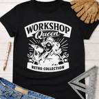 Black cotton Women's funny woodworking graphic tee shirt for female woodworkers, makers, and DIY builders — Sawdust & Ponytails, featuring a retro "Workshop Queen" design with a woman holding a drill and wrench.