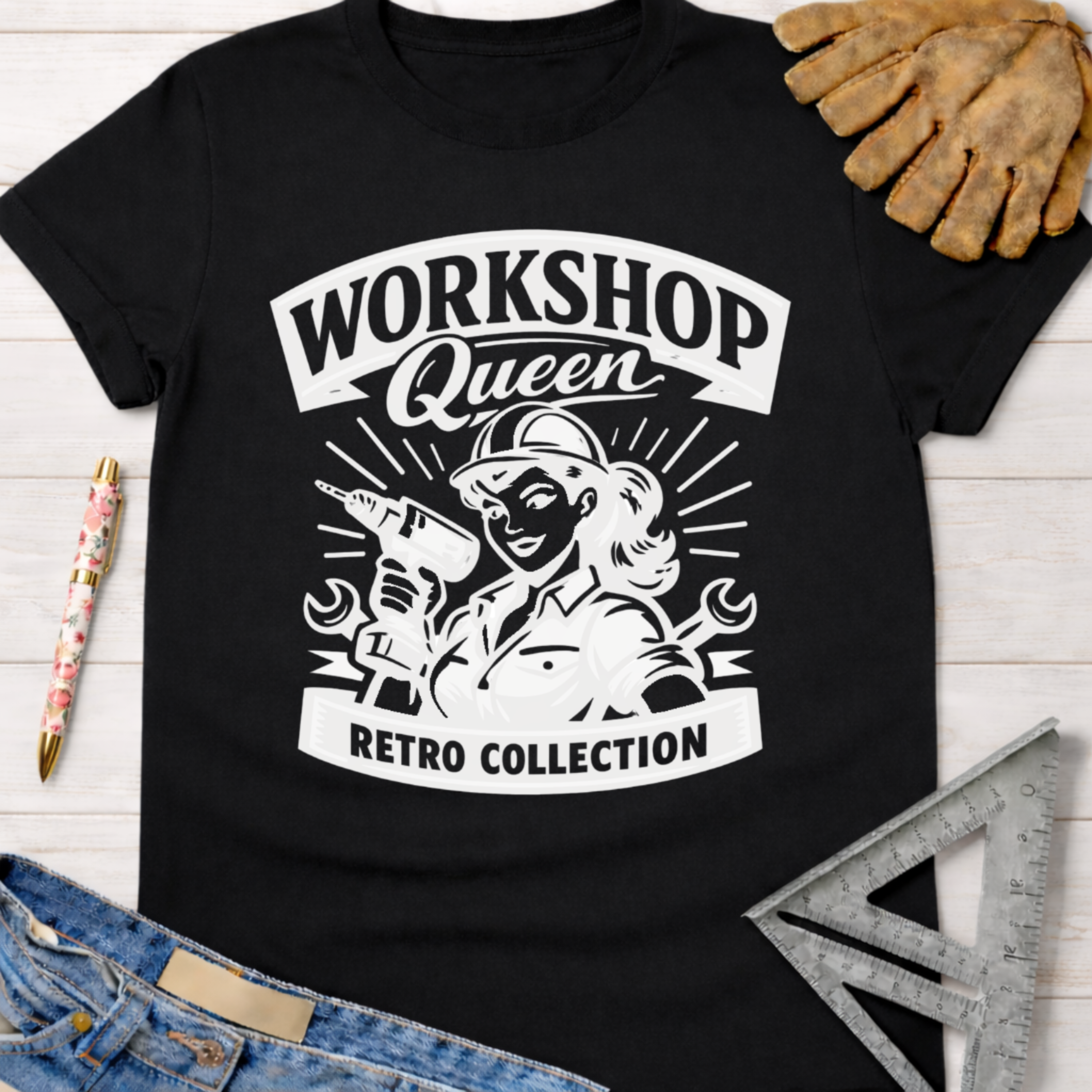 Black cotton Women's funny woodworking graphic tee shirt for female woodworkers, makers, and DIY builders — Sawdust & Ponytails, featuring a retro "Workshop Queen" design with a woman holding a drill and wrench.