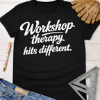 Black cotton "Workshop therapy hits different" tee, women's funny woodworking graphic shirt for makers.