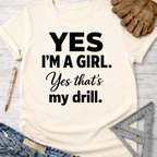 Women's funny woodworking graphic tee shirt for female woodworkers, makers, and DIY builders — Sawdust & Ponytails. Cream t-shirt with "YES I'M A GIRL. Yes that's my drill." in black text.
