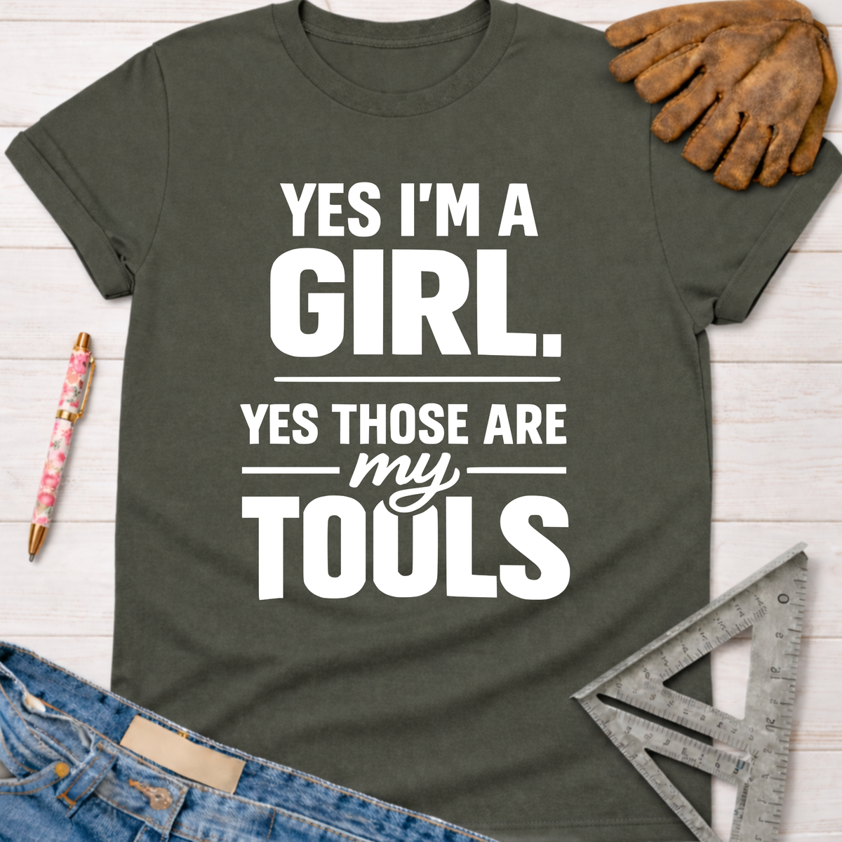 Dark gray crew neck t-shirt with "YES I'M A GIRL. YES THOSE ARE MY TOOLS" in white text. Women's funny woodworking graphic tee shirt for female woodworkers, makers, and DIY builders — Sawdust & Ponytails