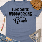 Women's funny woodworking graphic tee shirt for female woodworkers, makers, and DIY builders — Sawdust & Ponytails. Blue cotton tee with "I LIKE COFFEE, WOODWORKING AND MAYBE 3 PEOPLE" in black text.