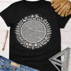 Women's funny woodworking graphic tee shirt for female woodworkers, makers, and DIY builders — Sawdust & Ponytails. Black cotton tee with white tree ring, deer, mountains, and floral design.